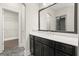 Modern bathroom features a black vanity and a walk-in closet at 1620 Brook Ivy Dr, Lawrenceville, GA 30044