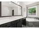 Bathroom boasts double vanity, soaking tub, and marble countertops at 1620 Brook Ivy Dr, Lawrenceville, GA 30044