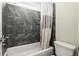 Full bath featuring tile surround, updated fixtures, and a shower-tub combo at 1620 Brook Ivy Dr, Lawrenceville, GA 30044
