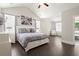 Spacious main bedroom with hardwood floors, many windows, and an on-suite bathroom at 1620 Brook Ivy Dr, Lawrenceville, GA 30044