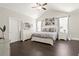 Bright bedroom features a vaulted ceiling, dark wood floors, and neutral decor at 1620 Brook Ivy Dr, Lawrenceville, GA 30044