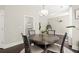 This dining area features neutral walls and dark floors, a round table with seating for four at 1620 Brook Ivy Dr, Lawrenceville, GA 30044