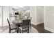 Dining area featuring a round table and view to kitchen and living area at 1620 Brook Ivy Dr, Lawrenceville, GA 30044