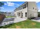 The backyard shows the two-story home, attached garage, lawn, and a concrete patio at 1620 Brook Ivy Dr, Lawrenceville, GA 30044