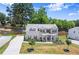 Aerial view of two-story home boasts beautiful lawn and a brick and siding exterior at 1620 Brook Ivy Dr, Lawrenceville, GA 30044