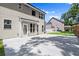 Exterior shows the back of a two-story home with a covered porch and concrete patio at 1620 Brook Ivy Dr, Lawrenceville, GA 30044