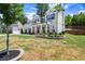 Two-story brick home with manicured landscaping and a well-maintained lawn at 1620 Brook Ivy Dr, Lawrenceville, GA 30044