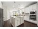 Bright kitchen featuring stainless steel appliances, an island, and hardwood floors at 1620 Brook Ivy Dr, Lawrenceville, GA 30044