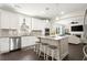 Bright kitchen with stainless steel appliances, an island with seating, and an open concept design at 1620 Brook Ivy Dr, Lawrenceville, GA 30044