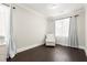 Sitting area with hardwood floors, a comfortable chair, and natural light at 1620 Brook Ivy Dr, Lawrenceville, GA 30044