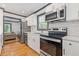 Kitchen boasts stainless appliances, white cabinets, subway tile, and modern fixtures at 2776 Grand Ave, Atlanta, GA 30315