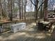 Spacious deck with dining set, cooler, and wooded views of the lake at 5440 Portside Dr, Acworth, GA 30101