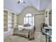 Comfortable bedroom featuring built-in shelves and a large window with great natural light at 4221 Bretdale Nw Run, Kennesaw, GA 30152