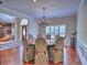 Elegant dining room with a large round table, upholstered chairs, and hardwood floors at 4221 Bretdale Nw Run, Kennesaw, GA 30152