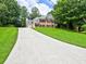 Beautiful two-story home with a long driveway and well-maintained lawn and mature trees at 4221 Bretdale Nw Run, Kennesaw, GA 30152