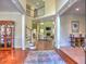 Spacious foyer with a staircase, hardwood floors, and an open view into the living room at 4221 Bretdale Nw Run, Kennesaw, GA 30152