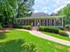 Charming covered porch, landscaped front yard, and inviting entryway create curb appeal at 4221 Bretdale Nw Run, Kennesaw, GA 30152