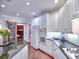 Bright kitchen features white cabinets, granite countertops, stainless appliances, and an adjacent pantry at 4221 Bretdale Nw Run, Kennesaw, GA 30152