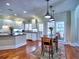 The modern kitchen flows into the dining area and features ample counter space and natural lighting at 4221 Bretdale Nw Run, Kennesaw, GA 30152