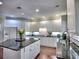 Modern kitchen with white cabinetry, stainless steel appliances, a center island, and stylish countertops at 4221 Bretdale Nw Run, Kennesaw, GA 30152