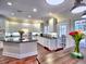 The kitchen features white cabinets, granite countertops, stainless appliances, and hardwood floors at 4221 Bretdale Nw Run, Kennesaw, GA 30152