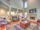 Bright living room with a fireplace, recessed lighting, hardwood floors, and comfortable seating arrangement at 4221 Bretdale Nw Run, Kennesaw, GA 30152