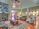 Spacious living room featuring hardwood floors, columns, and an open floor plan to the gourmet kitchen at 4221 Bretdale Nw Run, Kennesaw, GA 30152