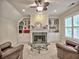 Inviting living room featuring a fireplace, built-in shelves, a glass coffee table and comfortable seating at 4221 Bretdale Nw Run, Kennesaw, GA 30152