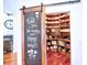 Walk-in pantry with custom wood shelving and an adjacent chalkboard offering a message for the tour at 4221 Bretdale Nw Run, Kennesaw, GA 30152