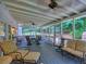 Inviting screened-in porch with ample seating and ceiling fans at 4221 Bretdale Nw Run, Kennesaw, GA 30152