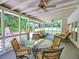 Large screened porch featuring seating, ceiling fans, and privacy for relaxing and entertaining guests at 4221 Bretdale Nw Run, Kennesaw, GA 30152
