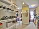 Neatly organized walk-in closet with wire shelving and rods for clothing and shoe storage at 4221 Bretdale Nw Run, Kennesaw, GA 30152