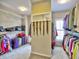 Well-organized walk-in closet featuring shelves for shoes, handbags, and clothes at 4221 Bretdale Nw Run, Kennesaw, GA 30152
