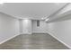 Unfinished basement with wood-look flooring, and bright white walls at 5277 Cardinal Nw Ln, Lilburn, GA 30047