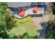 Aerial view showcasing the home's layout, expansive deck, and beautiful surroundings at 8531 Lake Dr, Snellville, GA 30039