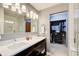 Modern bathroom with dual sink vanity, subway tile shower, and walk-in closet at 8531 Lake Dr, Snellville, GA 30039