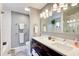 Modern bathroom with dual sink vanity, subway tile shower, and stylish fixtures at 8531 Lake Dr, Snellville, GA 30039