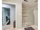 Modern bathroom features a walk-in shower with a glass door and tile surround at 8531 Lake Dr, Snellville, GA 30039