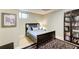 A serene bedroom features a wood bed frame, soft lighting, and built-in shelving at 8531 Lake Dr, Snellville, GA 30039