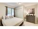 Bedroom with a large window, closet, and dresser offering ample storage space at 8531 Lake Dr, Snellville, GA 30039