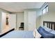 Light-filled bedroom with a view of the bathroom and built-in bookcase at 8531 Lake Dr, Snellville, GA 30039