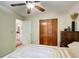 Bedroom features include a ceiling fan, wood dresser and a closet for storage at 8531 Lake Dr, Snellville, GA 30039
