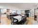 Open dining and kitchen area with island, stainless steel hood and large shelving unit at 8531 Lake Dr, Snellville, GA 30039