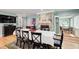 Dining room featuring a large table, chairs, and a fireplace at 8531 Lake Dr, Snellville, GA 30039