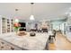 Eat-in kitchen with white cabinets, granite counters, stainless steel appliances, and plenty of counter space at 8531 Lake Dr, Snellville, GA 30039