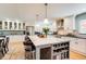 Modern kitchen with white cabinets, granite counters, stainless steel appliances, and a large center island at 8531 Lake Dr, Snellville, GA 30039