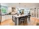 Gourmet kitchen features white cabinets, a large island, and display cabinets at 8531 Lake Dr, Snellville, GA 30039