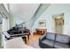 Spacious living area with high ceilings, piano, and large windows for natural light at 8531 Lake Dr, Snellville, GA 30039