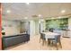 The cozy living room has a kitchenette, modern decor, and light wood flooring at 8531 Lake Dr, Snellville, GA 30039