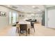 Open living space with dining table and doors that lead to the exterior of the home at 8531 Lake Dr, Snellville, GA 30039